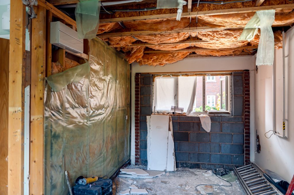 Professional Design Support vs. Pure DIY: A Cost-Mistake Breakdown 1 Deconstruction of room and garage with removing walls. No ceiling and floor. Big renovation project, wall removal and opening